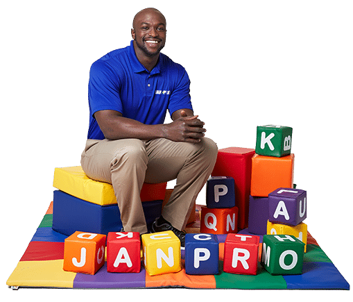 An African-American man JAN-PRO Cleaning & Disinfecting employee with daycare blocks lettering