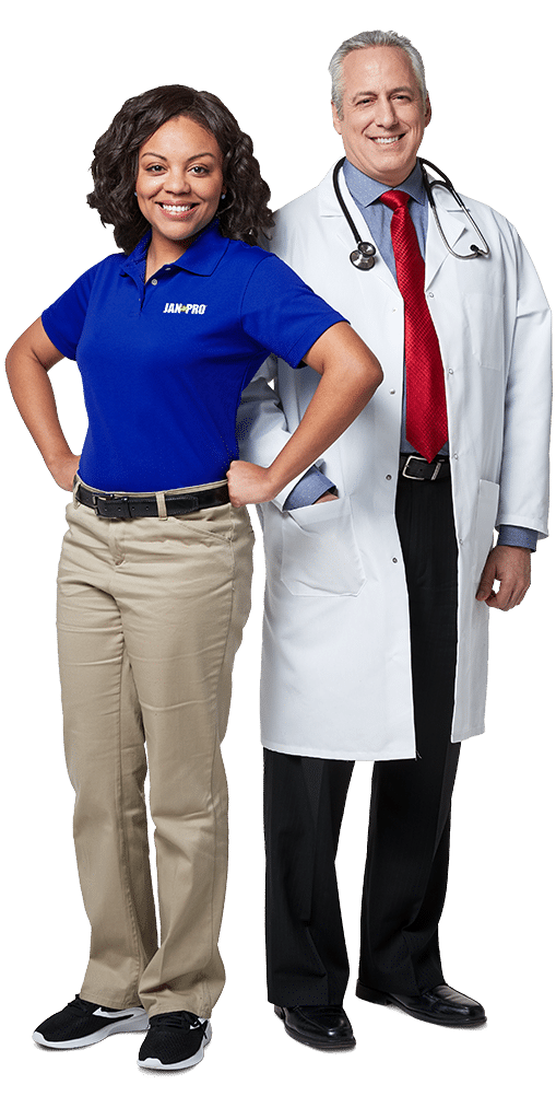 a woman in JPSI attire and a male doctor with a white coat and stethoscope posing