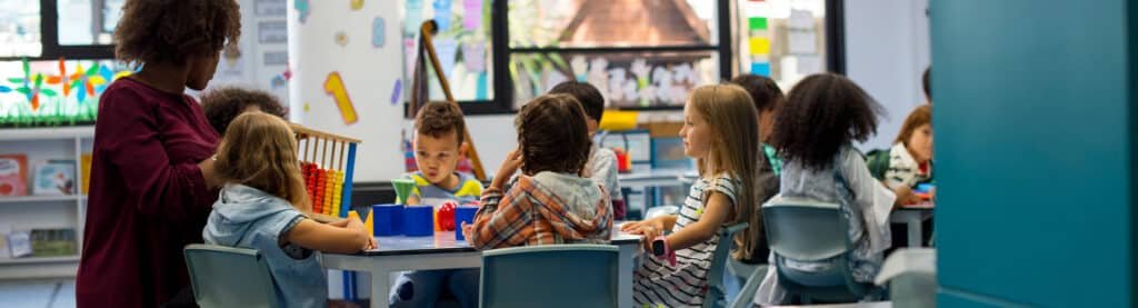 a teacher talking with her students