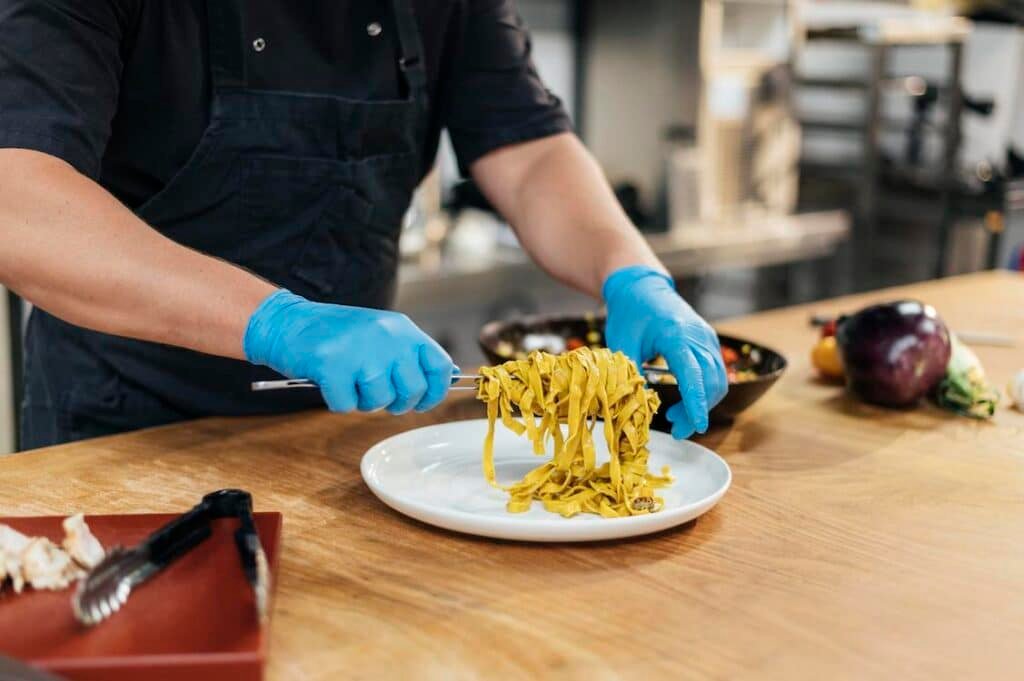 a cook preparing a meal at a restaurant.