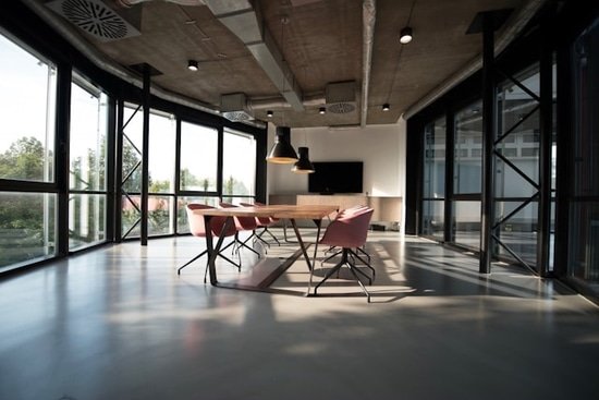 clean and organized office with wall to wall windows