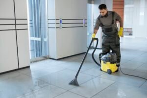 Image of a commercial cleaning professional cleaning tile floors.