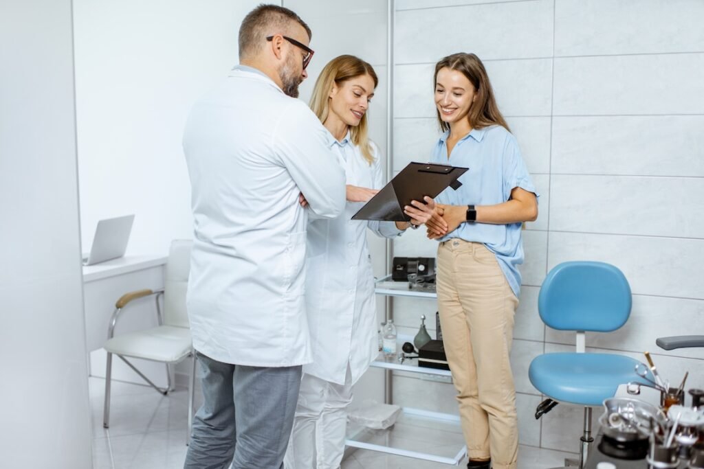 Young patient with two doctors during a medical consultation