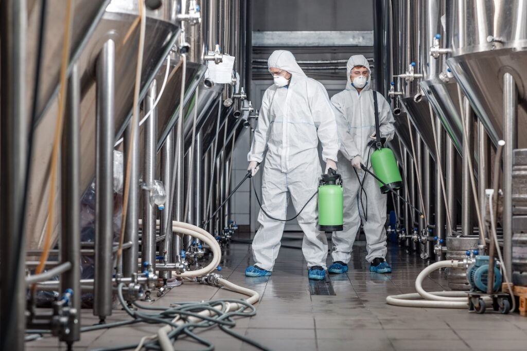 Industrial cleaners cleaning a factory.